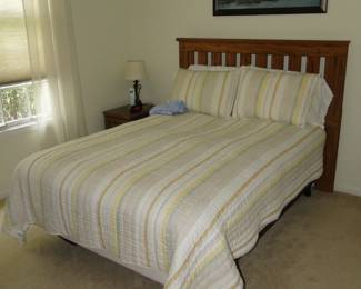 Queen bed. The headboard is of Missionary Style