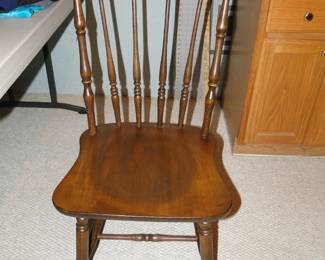 Just a random chair, with spindle backs, and concave seat