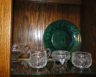 Some clear cut glass pieces, and a green pressed glass piece
