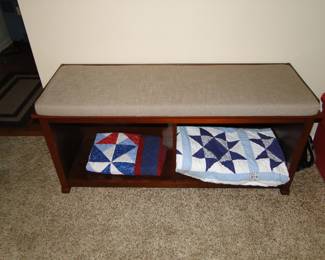 Entrance bench, take your shoes off bench, sit a spell bench. And some homemade quilts too