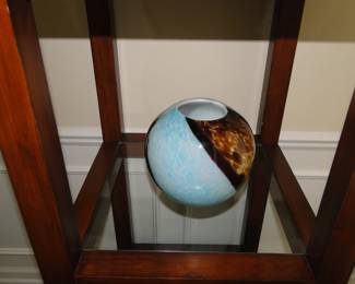 Blue and black orb, made of glass. Glass is fragile