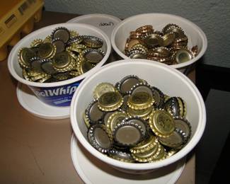 Three Cool Whip tubs of brand new bottle caps