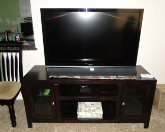 Large flat screen TV, with solid wood entertainment center