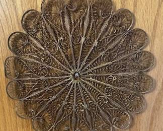 Vintage filigree (maybe copper) wall decor.