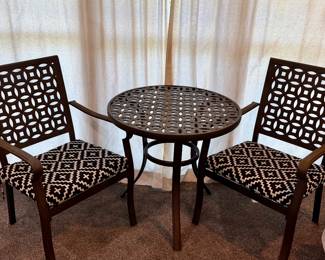Metal bistro set with cushion.