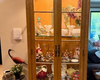 Lovely wood lighted curio cabinet filled with collectibles and pretty things!