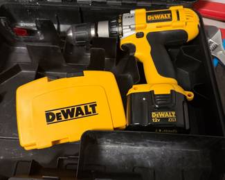 Like new DeWalt working cordless drill with two batteries, charger and bits.