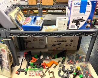 Dremel rotary tool kit, Dremel Table Workstation, and a set of Bessey square-jawed ratcheting hand clamps.