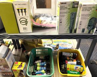 boxed Woods brand power strips, outdoor power stakes and generator cords, Several generator extension cords and assorted automotive fluids. 