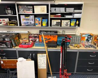 A Makita saw, a Central Pneumatic Contractor Series 21-Degree Angled Framing Nailer case, and a KAFAHOM Power Tool Organizer  