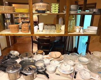 large collection of vintage home goods, including cookware, glassware, and storage containers.