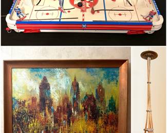 A vintage Tudor NHL PA All Star Hockey table top game, a vintage Jack Laycox canvas print titled "Sunday Afternoon," and a vintage 1962 Seattle World's Fair Space Needle souvenir sculpture.