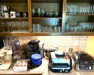 A Ninja Foodi Indoor Grill, and a Ninja Foodi Smart XL Pro Grill & Griddle tons of glassware and cookbooks.