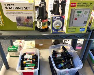 A Toro DDC-8 Irrigation Controller,  a Yardworks 5-piece Watering Set, sprinkler heads and nozzles.