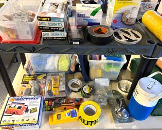 A Zircon MetalliScanner MT6 metal locator, A "Circuit Breaker Detective" tool, A Yellow Strait-Line stud finder, and a Suncourt Ductstat plug-in thermostat.