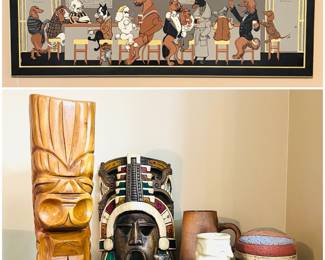 A collection of  several hand-carved Mayan or Aztec-style warrior masks and a framed print is "Bar Hounds" by American artist Constance Depler, 