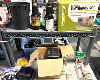 A Yardworks 5-piece watering set, Rain Bird AG-5 Maxi-Paw pop-up impact sprinkler and a  Rain Bird professional series pop-up sprinkler.