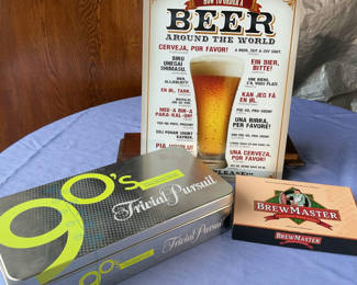 Lot 67: 90s Time Capsule Edition Trivial Pursuit, BrewMaster Beer Game, and Beer Around the World Poster