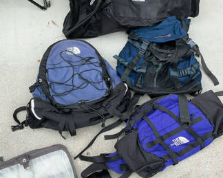 Lot 13: Assorted North Face outdoor backpacks and a duffel bag