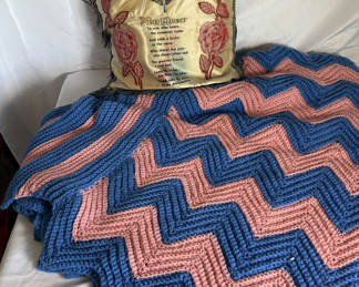 Lot 91: Blue and pink chevron crochet throw, floral bedspread, and decorative pillow