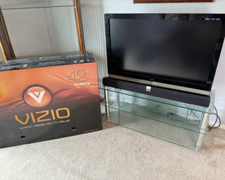 Lot 6: Vizio 42-inch LCD HDTV with glass TV stand