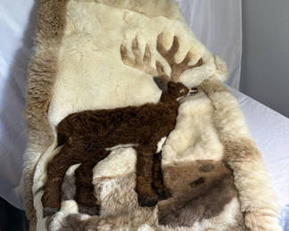 Lot 74: Sheep skin throw with Deer Design