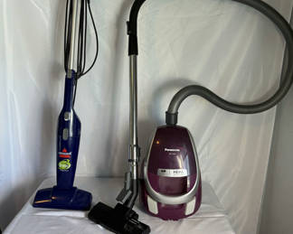 Lot 70: Panasonic Purple HEPA Canister Vacuum and Blue Bissell 3-way Bagless Vacuum with Attachments