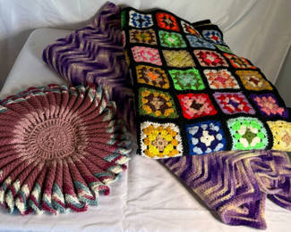 Lot 73: Crocheted blankets and a round pillow