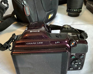 Lot 30: Assorted cameras, lenses, flash, and tripods