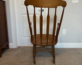 L42 - $35. Wooden Rocking Chair. Has been chewed by a puppy a long time ago. Still very sturdy, just a little nibble. As Is.