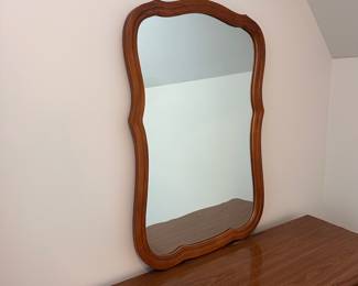 L16 - $125. Bassett Furniture Dresser with Mirror. Measures 52.5" wide x 17.75" deep x 31.75" tall. Mirror is 26" x 37". Mirror is NOT attached and is wall hanging. All drawers slide easily. Minor surface wear / marks.