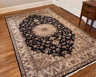 L80 - $125. Black & Ivory Area Rug. Measures 70" x 9'. Overall very good condition - was used in an office.