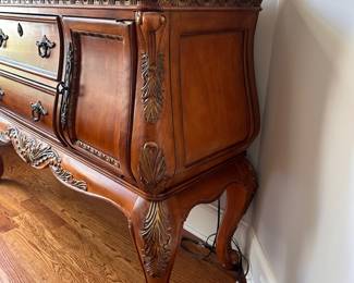 L4 - $250. Buffet / Side Board. Measures 59" x 18" deep x 39.5" tall. Has stone or marble top. All doors/drawers work as they should. Very good, gently used condition.