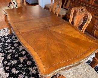 L2 - $375. Dining Table with 2 Captains Chairs, 4 regular chairs. Measures 6' long x 44" wide x 30" tall. 2 Leaves - 18" each. (Table can be 9' long full extended).