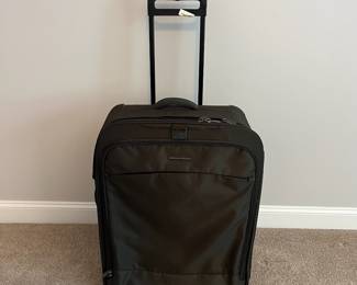L36 - $75. The Briggs & Riley TU127X-8 Upright. Grey expandable suitcase. Measures 22" x 8.5" x 27.5" tall. Does NOT have spinning wheels. Has been used but still very good condition!