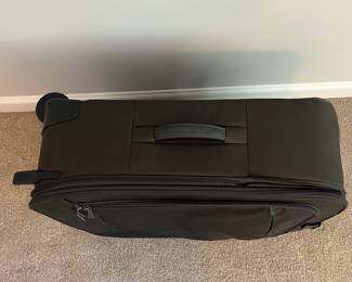 L36 - $75. The Briggs & Riley TU127X-8 Upright. Grey expandable suitcase. Measures 22" x 8.5" x 27.5" tall. Does NOT have spinning wheels. Has been used but still very good condition!