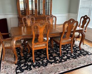 L2 - $375. Dining Table with 2 Captains Chairs, 4 regular chairs. Measures 6' long x 44" wide x 30" tall. 2 Leaves - 18" each. (Table can be 9' long full extended).