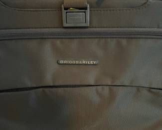 L36 - $75. The Briggs & Riley TU127X-8 Upright. Grey expandable suitcase. Measures 22" x 8.5" x 27.5" tall. Does NOT have spinning wheels. Has been used but still very good condition!