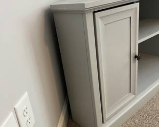 L34 - $60. Painted Media Stand. Measures 56.75" across the front x 18" x 28" tall. Very sturdy. Overall very good condition - does have a few minor paint scuff on the top. Was used in a corner for a TV stand.