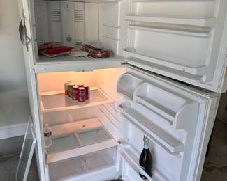 L99 - $75. Whirlpool Garage Fridge / Freezer. 2015. Works great - But looks like a garage fridge.