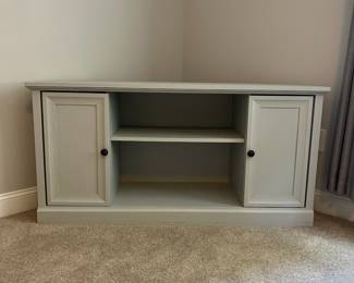 L34 - $60. Painted Media Stand. Measures 56.75" across the front x 18" x 28" tall. Very sturdy. Overall very good condition - does have a few minor paint scuff on the top. Was used in a corner for a TV stand.