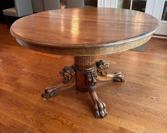 L10 - $350. Round or Oval Solid Wood Dining Table. Has carved lions on the base. Measures 48" round x 29.5" tall. 2 leaves are 11.5" each. I believe this is Hastings Table Co. or RJ Horner. Both made similar tables in the late 1800s. Table top isn't terrible but has a few marks here and there. Sturdy & very useable as is!