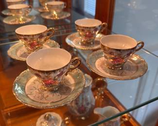 L23 - $35. Small Tea Set from "Sterling China". Teapot, creamer & sugar & 5 cups/saucers.