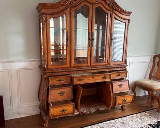 L3 - $250. Lighted China Cabinet. (Moves in 2 pieces). All drawers / door work as they should. Adjustable glass shelves. Measures 66" wide x 18" deep x 90" tall.