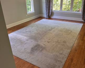 L15 - $95. Dalyn Rug Company. "Laramie" 9' x 13'. AS IS. Rug is sun faded as seen in the photos. The darker color is where the bed was - it does not vacuum to be the same color.