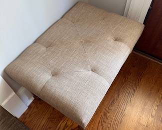 L28 - $25. Small upholstered entry bench. Measures 26" x 18" x 17" tall. Very good condition. Has adjustable feet.