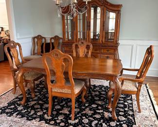 L2 - $375. Dining Table with 2 Captains Chairs, 4 regular chairs. Measures 6' long x 44" wide x 30" tall. 2 Leaves - 18" each. (Table can be 9' long full extended).