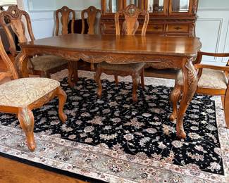 L2 - $375. Dining Table with 2 Captains Chairs, 4 regular chairs. Measures 6' long x 44" wide x 30" tall. 2 Leaves - 18" each. (Table can be 9' long full extended).