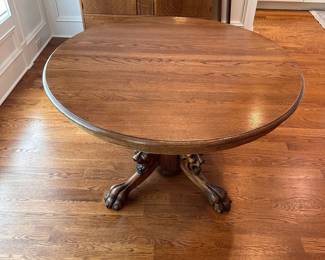 L10 - $350. Round or Oval Solid Wood Dining Table. Has carved lions on the base. Measures 48" round x 29.5" tall. 2 leaves are 11.5" each. I believe this is Hastings Table Co. or RJ Horner. Both made similar tables in the late 1800s. Table top isn't terrible but has a few marks here and there. Sturdy & very useable as is!