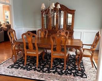 L2 - $375. Dining Table with 2 Captains Chairs, 4 regular chairs. Measures 6' long x 44" wide x 30" tall. 2 Leaves - 18" each. (Table can be 9' long full extended).